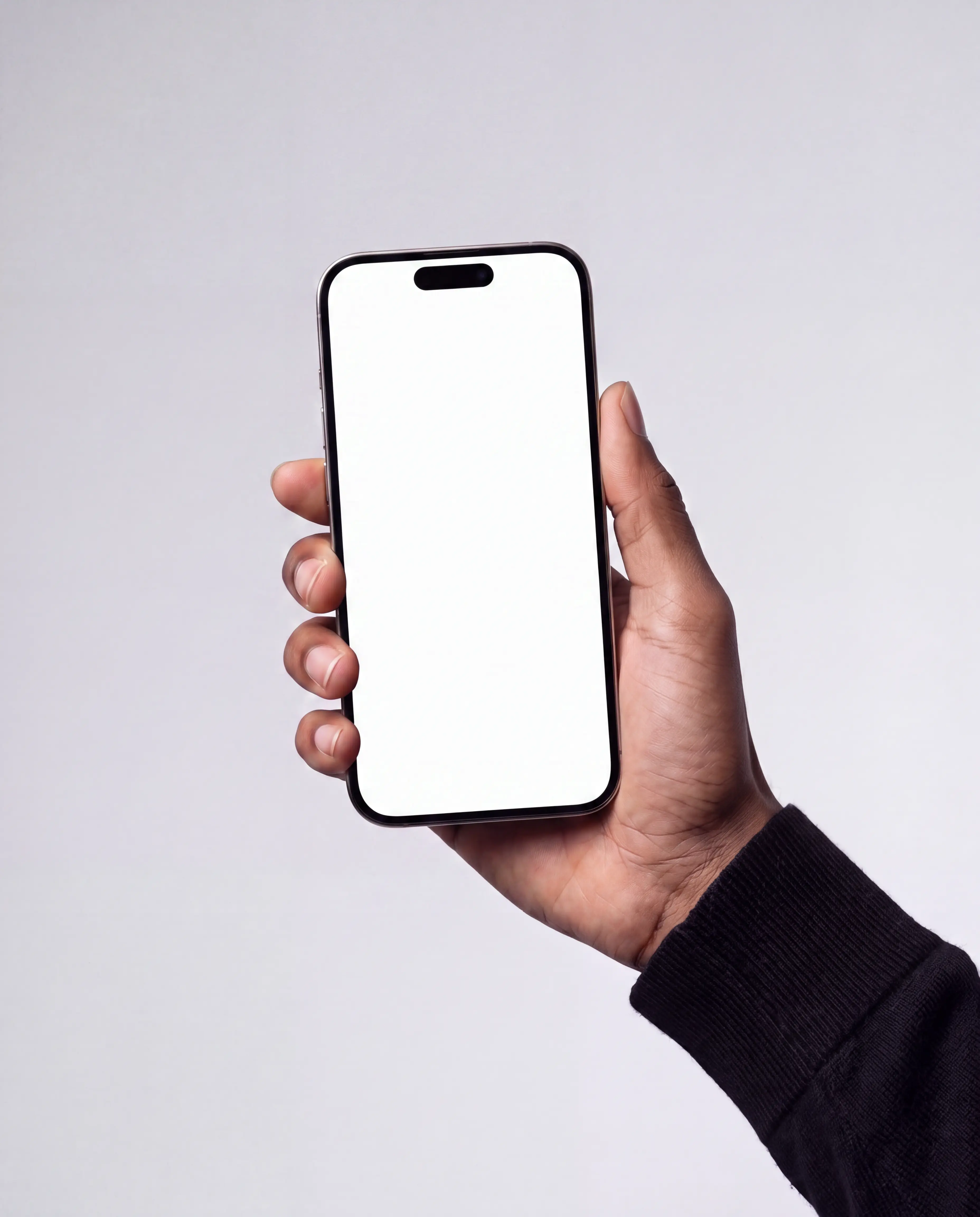 Front-facing modern black iPhone held upright in one hand against a softly lit light-grey studio background, with an editable white vertical display, rounded corners and visible Dynamic Island