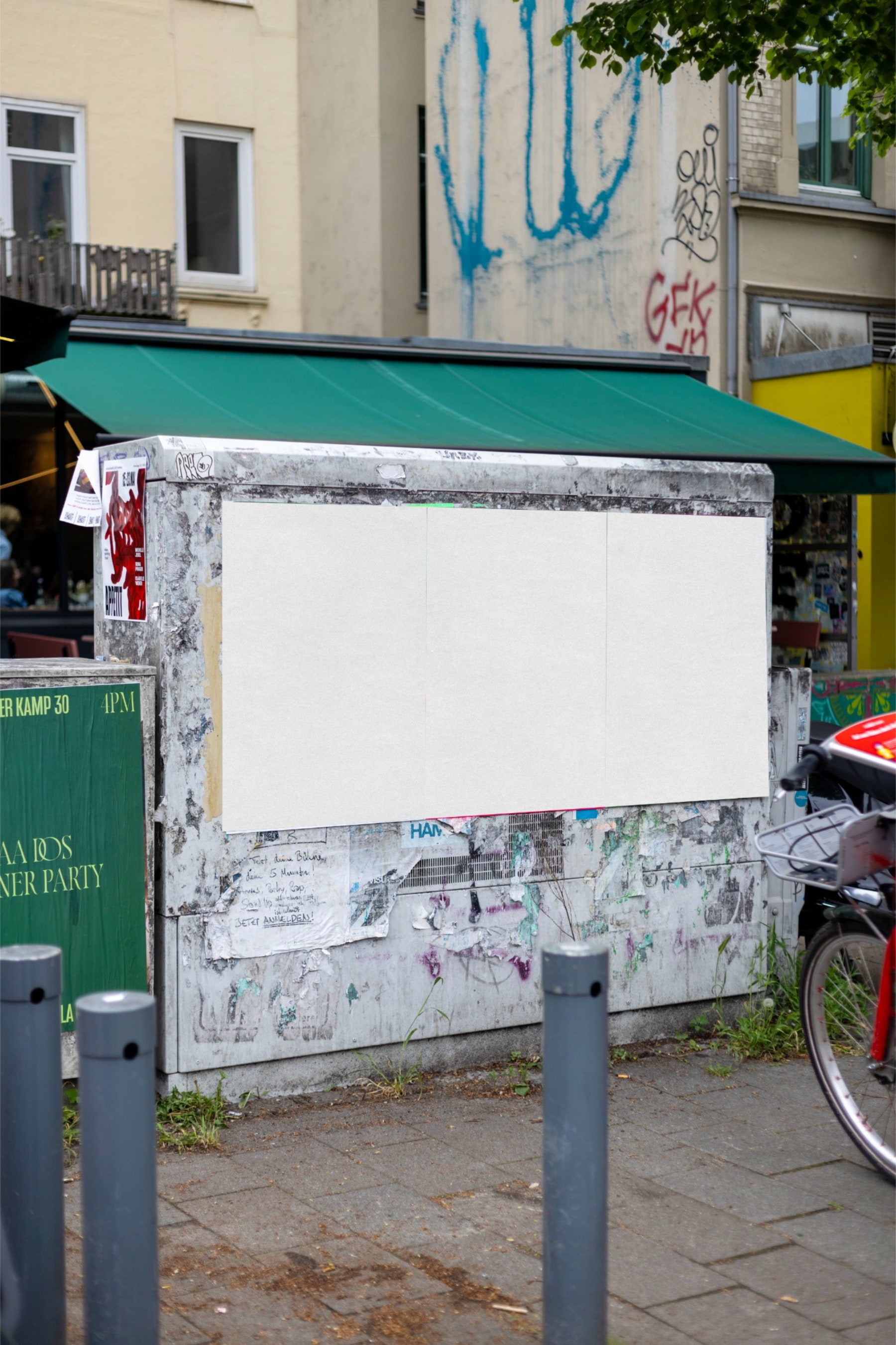 Three blank vertical poster areas next to each other on a weathered street wall in Hamburg
